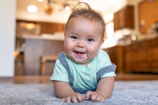 Baby laying on carpet flooring | Carpetland USA