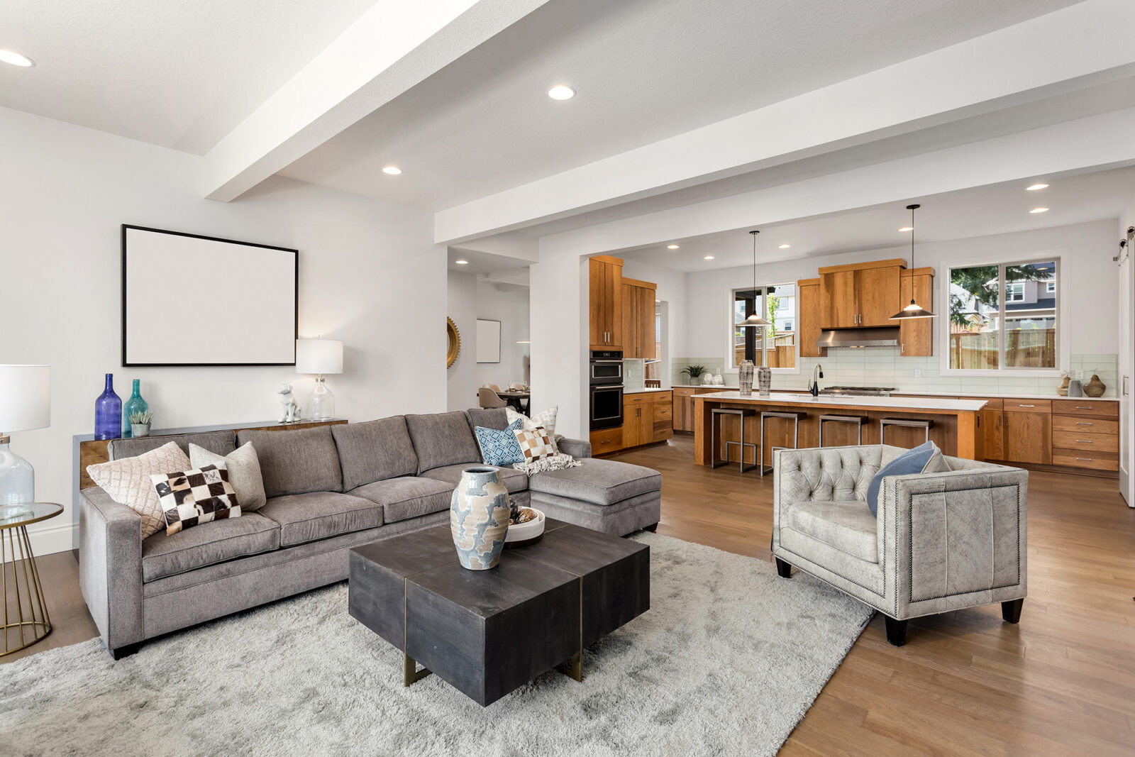 Modern family home interior with wood look vinyl flooring in a bright open concept living space