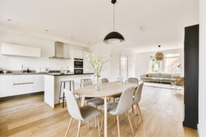 Modern kitchen and living space featuring laminate flooring